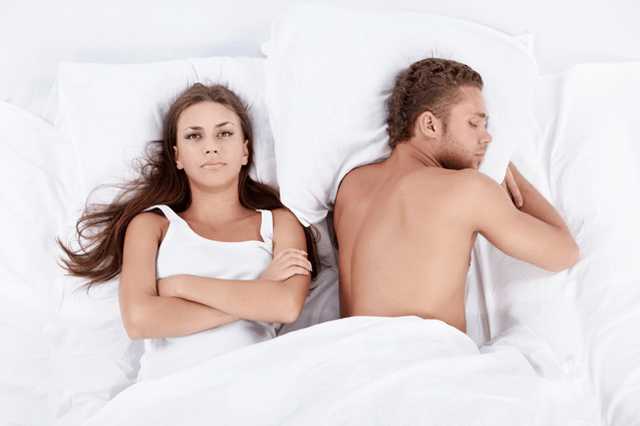Woman in bed with a man with low potency